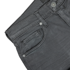 Close-up of the waistband and pockets of Paige's Charcoal Cotton Transcend Federal Slim Jeans, showcasing the stitching, button, and belt loops against a plain background. Experience the comfortable fit and durability with Transcend fabric.