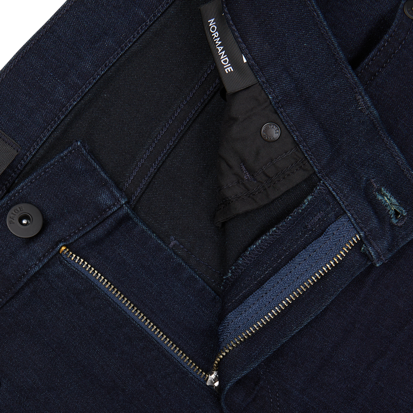 Dark Paige Transcend Normandie blue jeans with zipper fly and waistband button fastened, showcasing the brand label "normandie".