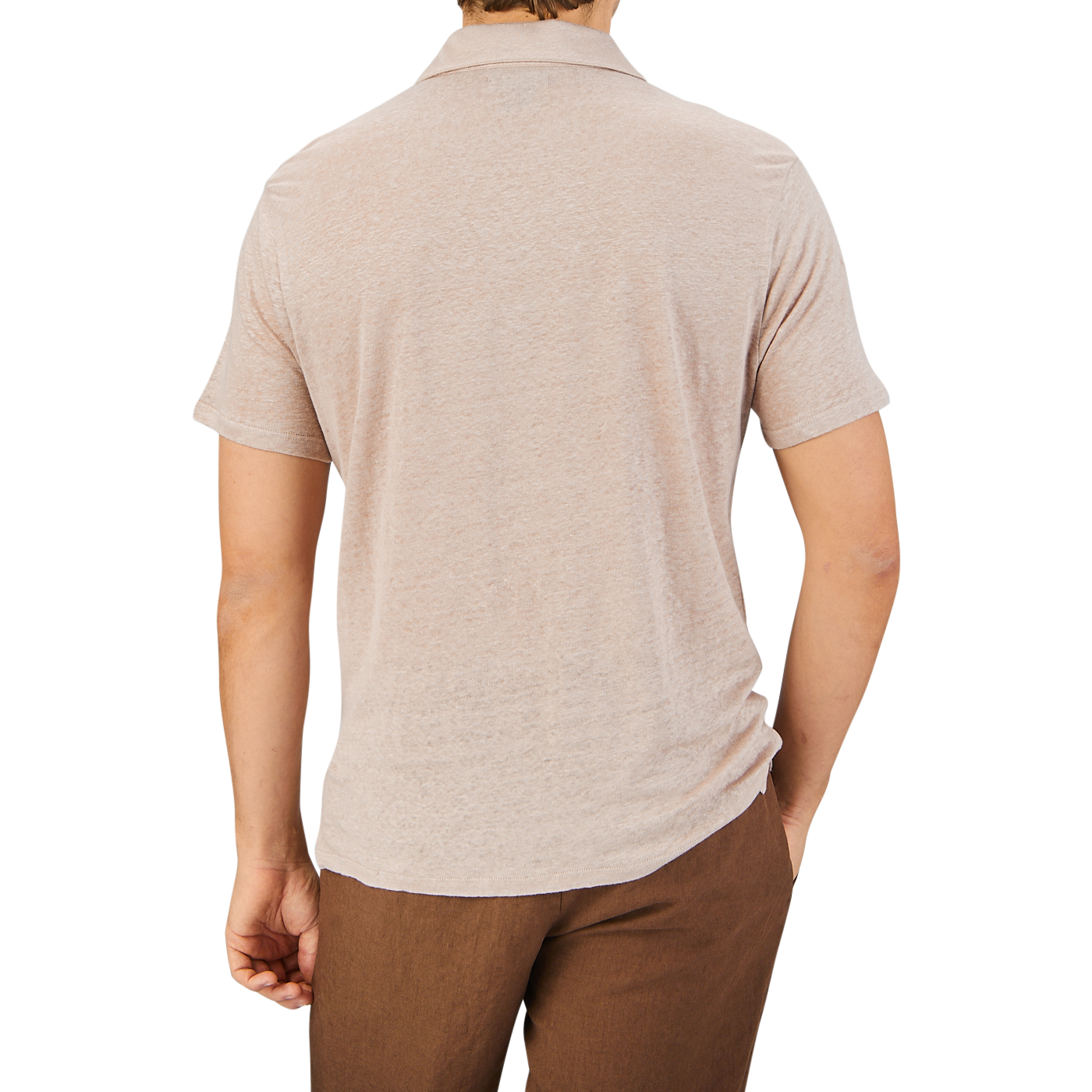 Rear view of a man wearing a Paige Light Pink Linen Capri Collar Polo Shirt and brown pants, standing against a plain grey background.
