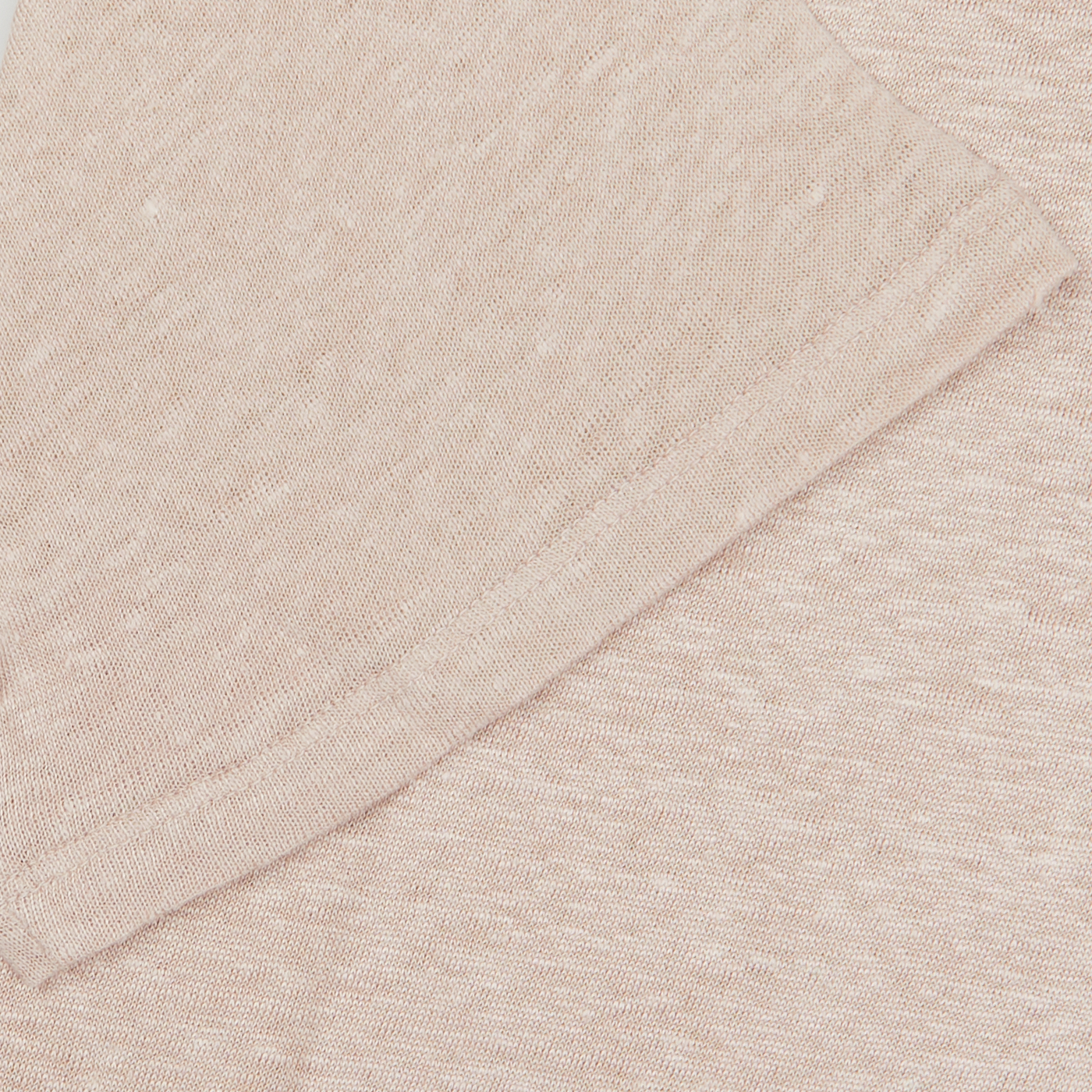 Close-up of a Paige Light Pink Linen Capri Collar Polo Shirt with a visible weave pattern.