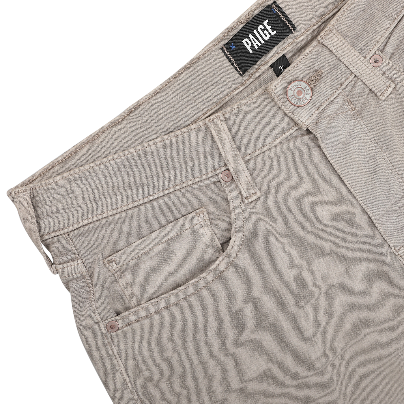 The Moroccan Clay Cotton Transcend Federal Slim Jeans, crafted by Paige, showcase a unique Moroccan clay color and feature light beige denim. The jeans include a front pocket with a visible button and the "Paige" label elegantly displayed on the waistband, enhancing their versatile style.