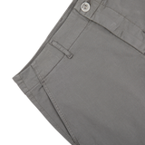 Close-up of a Slate Grey Cotton Blend Phillips Shorts pocket with a button on a white background.