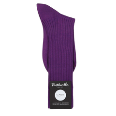 The Purple Egyptian Cotton Lisle Danvers Ankle Socks by Pantherella feature a refined rib knit design, crafted from luxurious Egyptian cotton lisle yarn, perfect for men's dress attire.