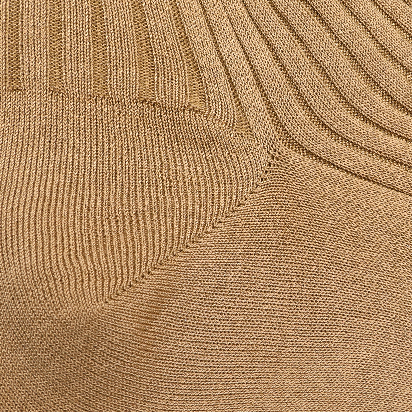 Close-up of the Light Khaki Egyptian Cotton Isle Danvers Ankle Socks by Pantherella, showcasing their ribbed knitted fabric with distinctive diagonal and vertical patterns, similar to textures found in traditional rib-knit men's dress socks.