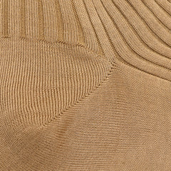 Close-up of the Light Khaki Egyptian Cotton Isle Danvers Ankle Socks by Pantherella, showcasing their ribbed knitted fabric with distinctive diagonal and vertical patterns, similar to textures found in traditional rib-knit men's dress socks.