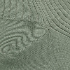 Close-up of sage Egyptian cotton fabric, similar to the luxurious texture of Pantherella's Isle Danvers ankle socks, showcasing two intersecting ribbing patterns.