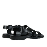 A pair of Black Lis Noir Leather Noumea platform sandals with adjustable straps, isolated on a transparent background.
