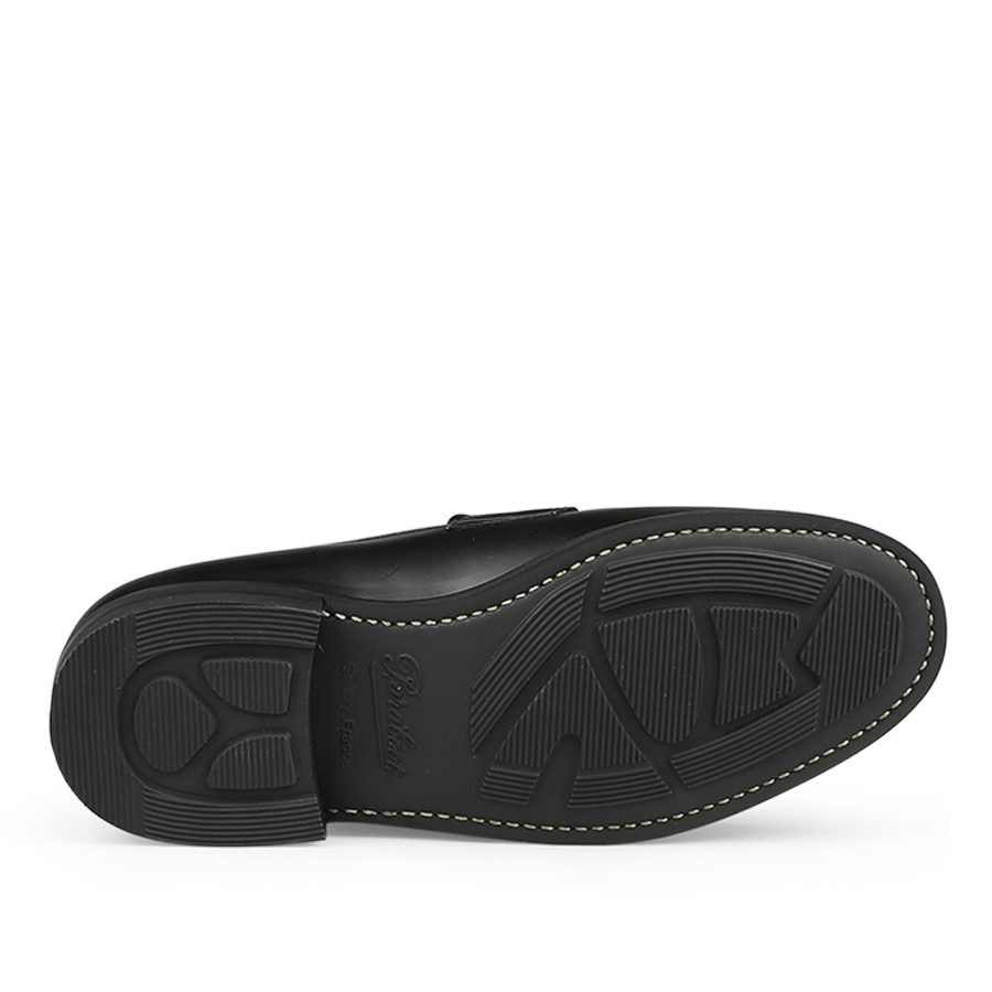 The image displays the sole of Paraboot's Black Leather Adonis Rubber Sole Loafers, highlighting a textured pattern with edge stitching, exemplifying Paraboot's craftsmanship.