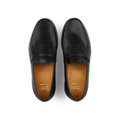 Paraboot's Black Leather Adonis Rubber Sole Loafers feature a rich brown inner lining and embody classic French loafer style, viewed from above.