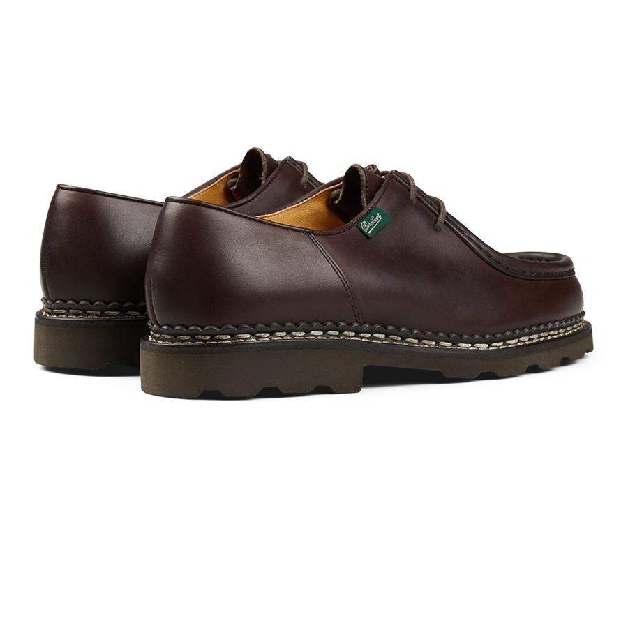 A pair of dark brown Lis Cafe leather men's shoes with thick rubber soles, in the Paraboot Michael model.