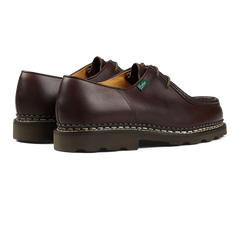 A pair of dark brown Lis Cafe leather men's shoes with thick rubber soles, in the Paraboot Michael model.