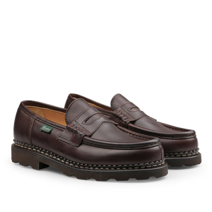 The Brown Lis Cafe Leather Reims Loafers by Paraboot feature chunky soles and visible stitching, expertly crafted with the brand's renowned Norwegian-welt construction.