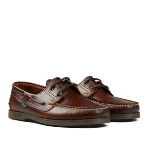 A pair of maroon Paraboot America Leather Barth Moccasins with white stitching and rawhide laces.