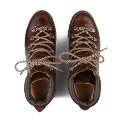 A pair of Paraboot Marron Lis Ecorce Leather Avoriaz Hiking Boots, featuring beige and brown laces and a durable commando rubber sole, is ideal for urban hikes when viewed from above.