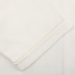 Close-up of the textured fabric with a rolled edge, as seen in Peregrine's Cream Dry Cotton Cuban Collar Shirt.