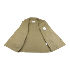 The Peregrine Khaki Green Linen Grange Shacket is displayed flat on a white surface, showcasing its pure linen interior and a tag on the right side.