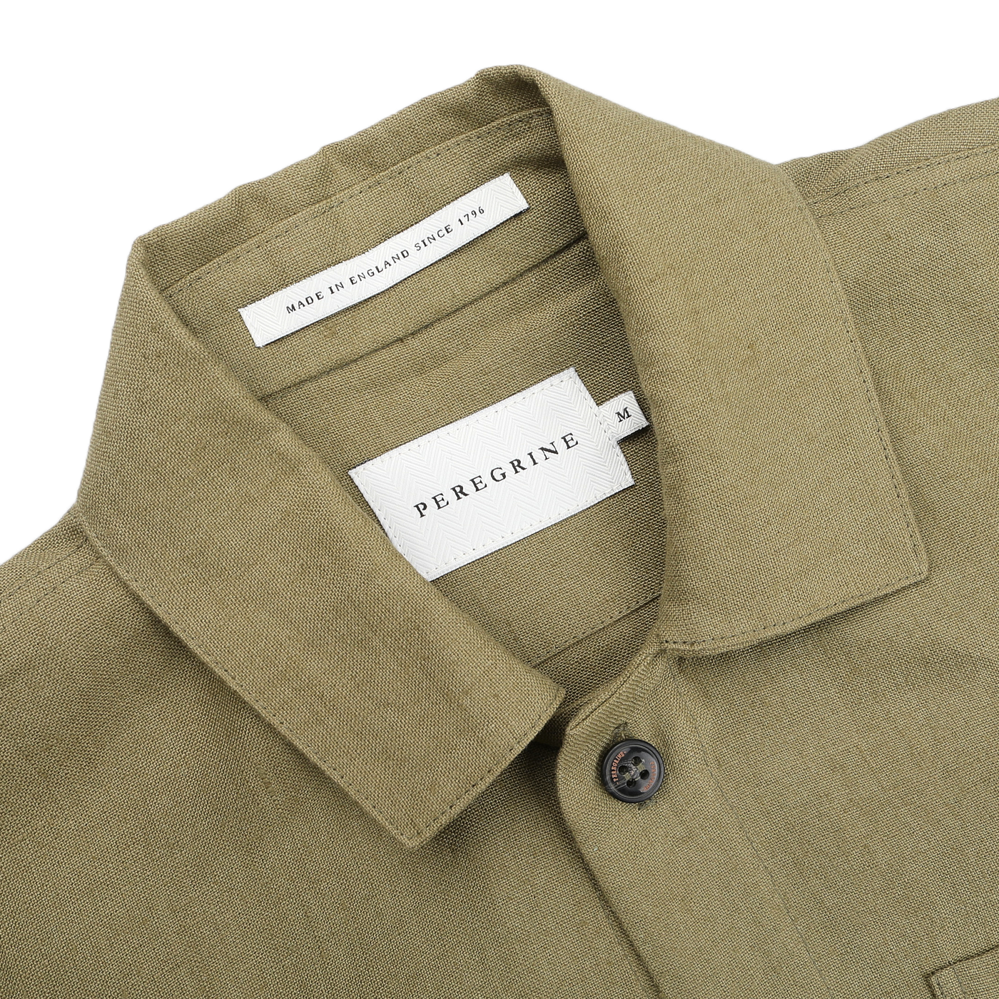 Khaki green linen Grange shacket by Peregrine, labeled "Made in England Since 1796," features a collar and one visible button.