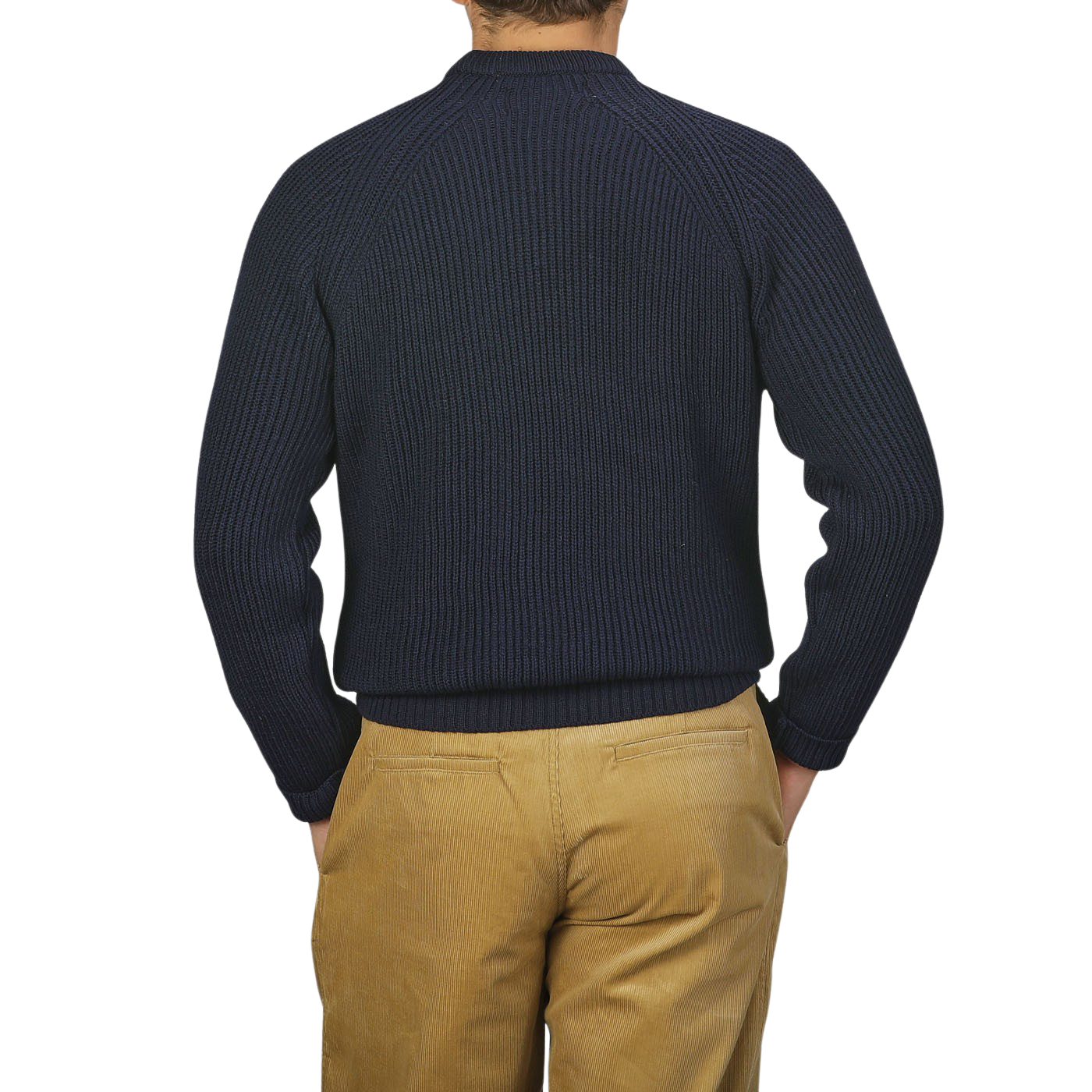 A person is shown from the back, wearing a Navy Blue Wool Ford Raglan Crewneck by Peregrine and beige pants, with their hands in their pockets.