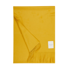 A Mustard Yellow Cashmere Aeternum Scarf with fringed endings on a white background.