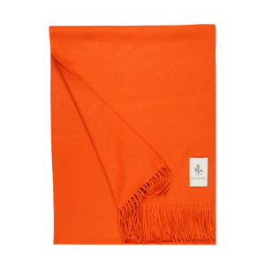 A Bright Orange Cashmere Aeternum Scarf with fringes on a white background, made by Piacenza Cashmere.