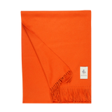 A Bright Orange Cashmere Aeternum Scarf with fringes on a white background, made by Piacenza Cashmere.