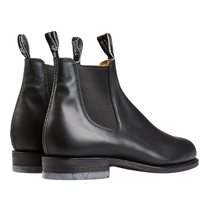 A pair of weather-resistant R.M. Williams Black Yearling Leather Wentworth G boots with pull tabs.