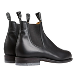 A pair of weather-resistant R.M. Williams Black Yearling Leather Wentworth G boots with pull tabs.
