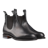 A pair of weather-resistant R.M. Williams Black Yearling Leather Wentworth G Chelsea boots with elastic side panels.