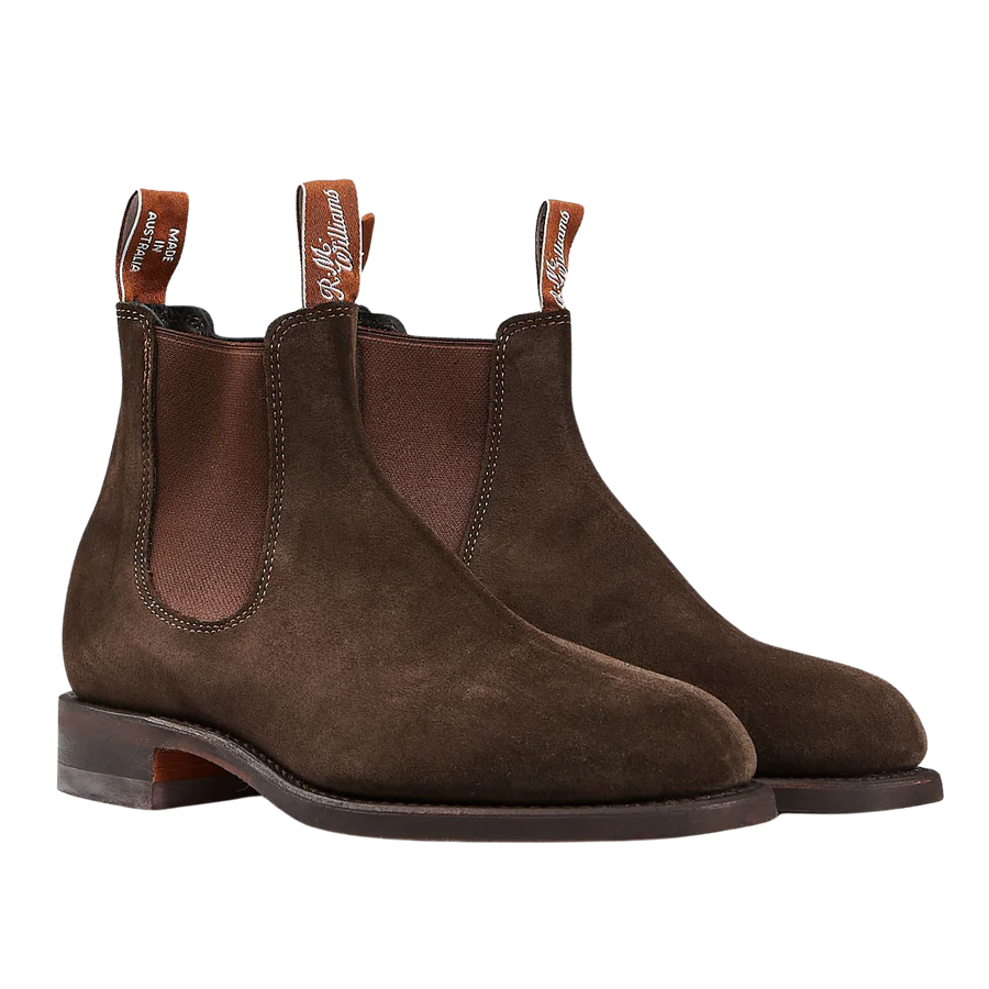 A pair of Chocolate Brown Suede Wentworth G Boots by R.M. Williams with elastic side panels, pull tabs, and weather resistance.