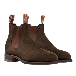 A pair of Chocolate Brown Suede Wentworth G Boots by R.M. Williams with elastic side panels, pull tabs, and weather resistance.