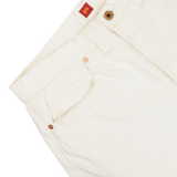 Close-up of a Resolute Cream Cotton Selvedge 714 One Wash Jeans pant featuring copper buttons and tan stitching, with a focus on the front pocket and waistband.