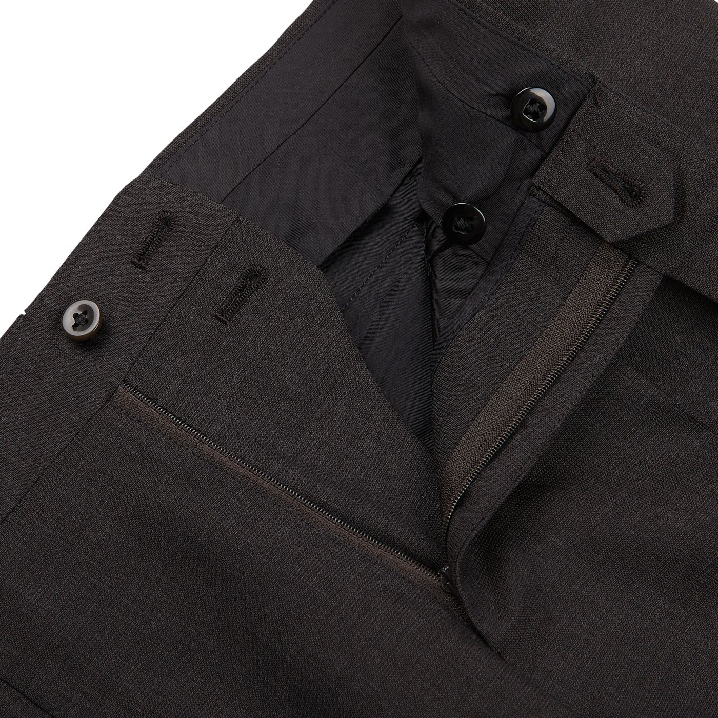 Close-up of a dark gray Ring Jacket High Twist Wool Suit focusing on the zipper and button details.