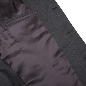 A close up of a full canvas Ring Jacket Grey High Twist Wool Suit with a purple pocket.