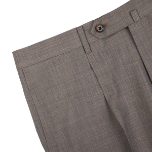 Close-up view of brown woolen dress pants with button closure from Ring Jacket Mid Grey High-Twist Wool Suit.