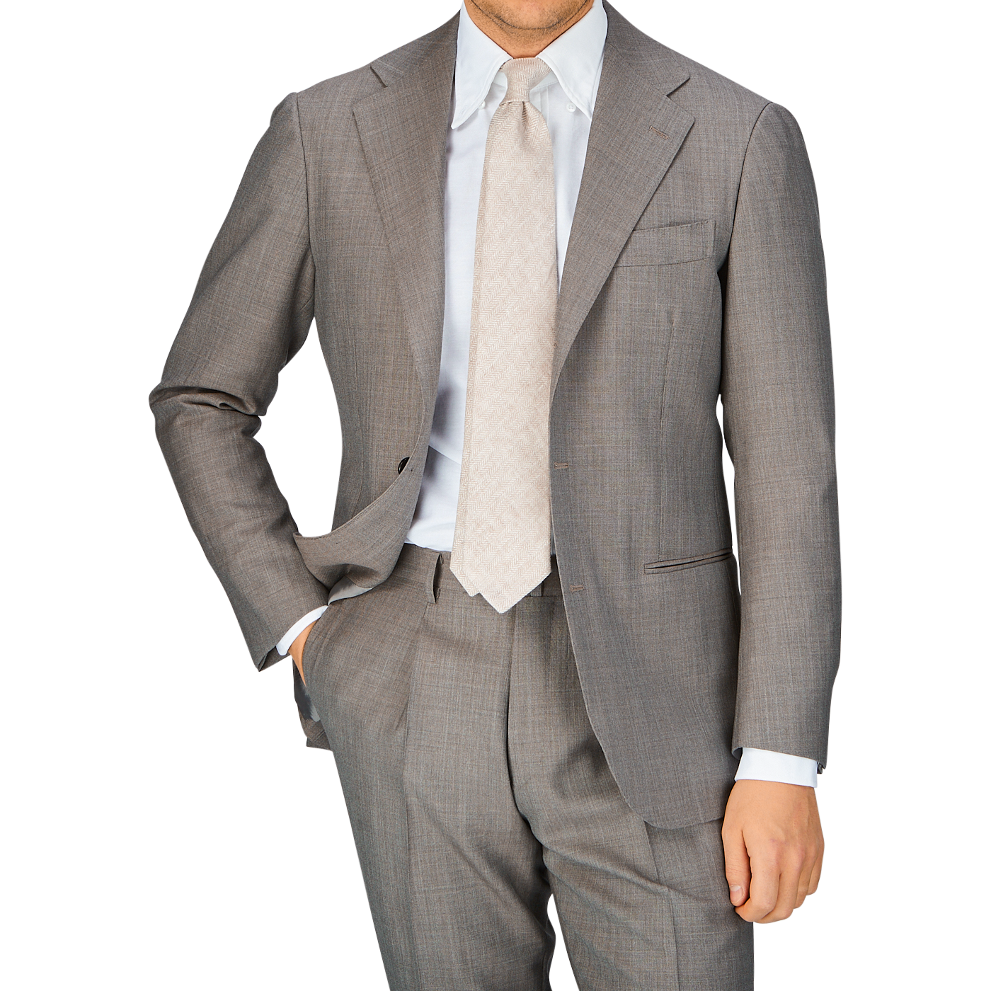 A man in a Ring Jacket Mid Grey High-Twist Wool Suit with his hand in his pocket.