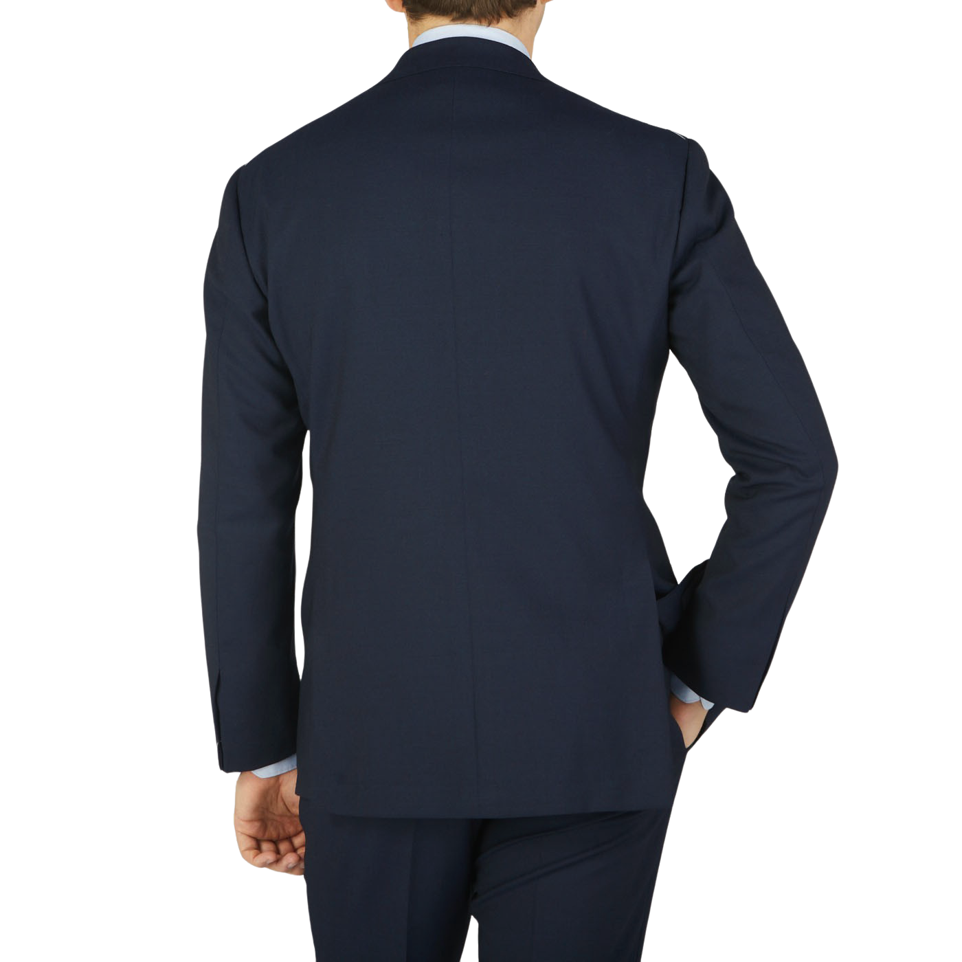 A man viewed from behind, wearing a navy blue high twist wool suit and matching pants in fresco fabric by Ring Jacket against a light background.