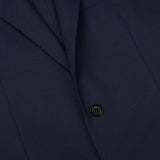 Close-up of a Ring Jacket navy blue high twist wool suit jacket with a single visible button crafted from fresco fabric.