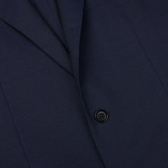 Close-up of a Ring Jacket navy blue high twist wool suit jacket with a single visible button crafted from fresco fabric.