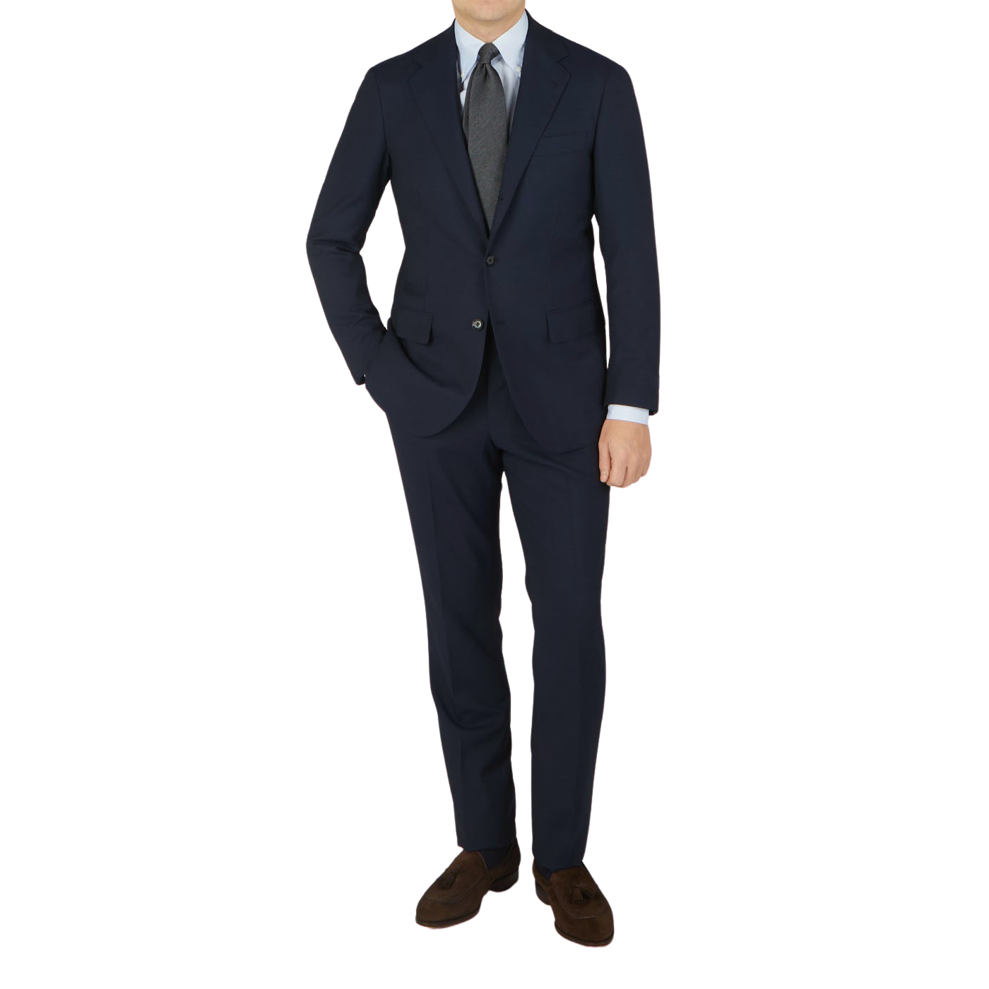 A man wearing a Ring Jacket Navy High Twist Wool Suit and tie made from fresco fabric.