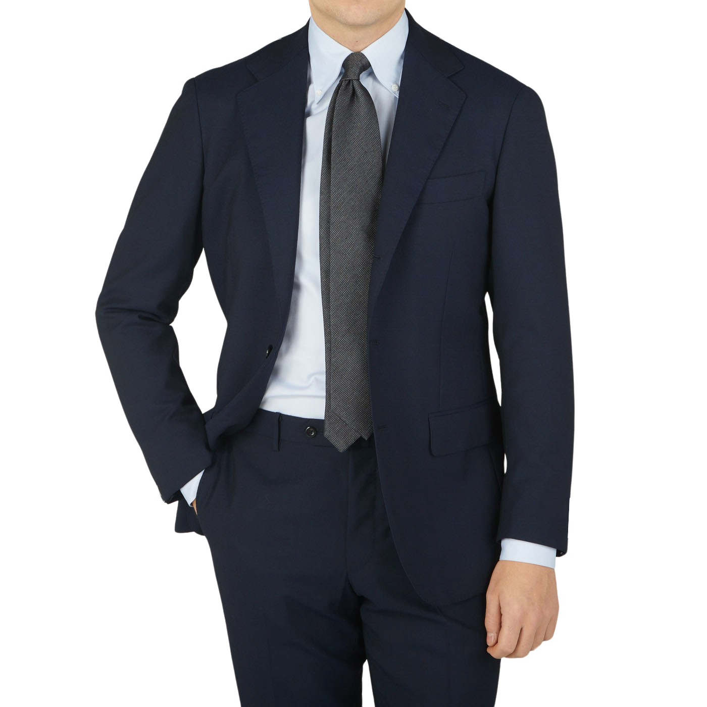 A man in a Ring Jacket navy high twist wool suit, wearing a blue tie.