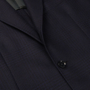A close up of a Ring Jacket Navy Tonal Checked Wool Balloon Blazer with black buttons.