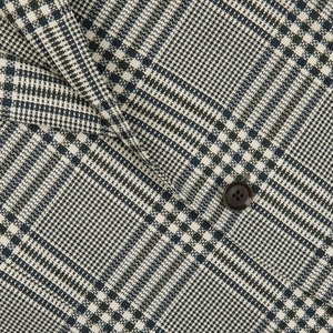 Close-up of a Blue Green Glen Check Balloon Wool Blazer from Ring Jacket, showcasing detailed weaving and stitching.