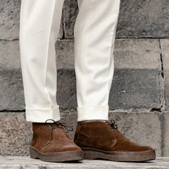 A pair of Sanders Chocolate Brown Suede Hi Top Boots with a rubber crepe sole.