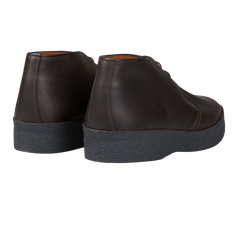 A pair of Sanders Dark Brown Savage Grain Hi Top Chukka Boots with a rubber sole.