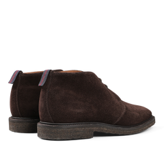 The Sanders Mocha Reverse Suede Harry Chukka Boots come with dark soles and striped pull tabs at the back.