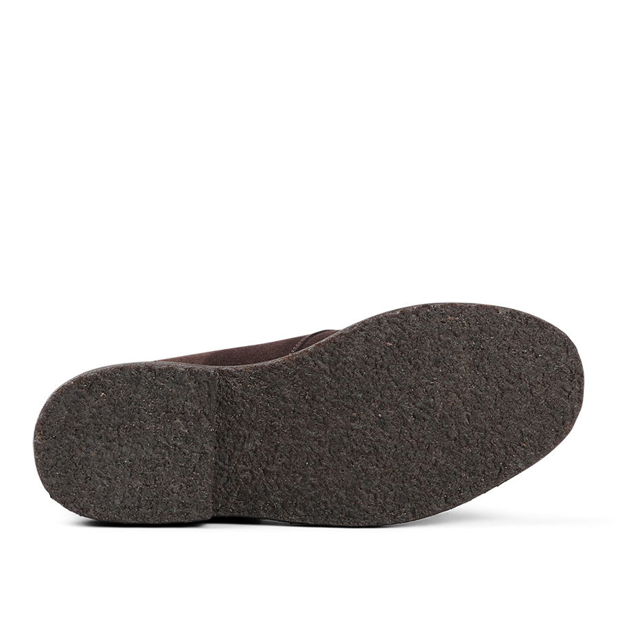 The image displays the sole of a Sanders Mocha Reverse Suede Harry Chukka Boot, with a textured surface and Goodyear welted construction.