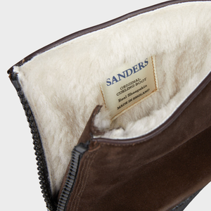 A brown suede pouch labeled Sanders Pinner Suede Leather Original Curling Boots.