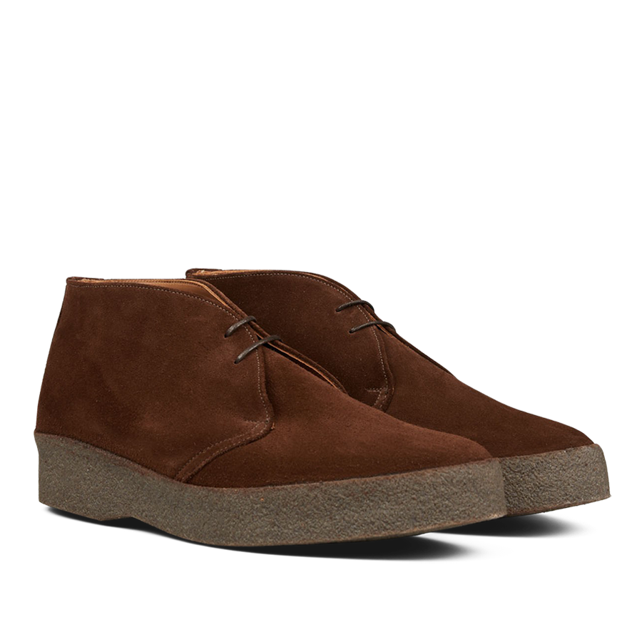 A pair of Polo Snuff Suede Hi Top Boots by Sanders with laces and a rubber crepe sole on a transparent background.