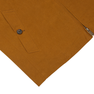 Brown skirt with a side zipper and a buttoned pocket detail, presented on a white background alongside a Sealup Tobacco Brown Cotton Harrington Waxed Jacket.