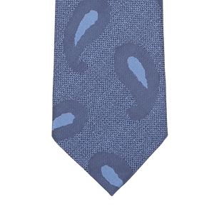 A detailed view of the Blue Paisley Woven Silk Tie by Seaward & Stearn, crafted in sumptuous handmade silk, displayed against a pristine white backdrop.